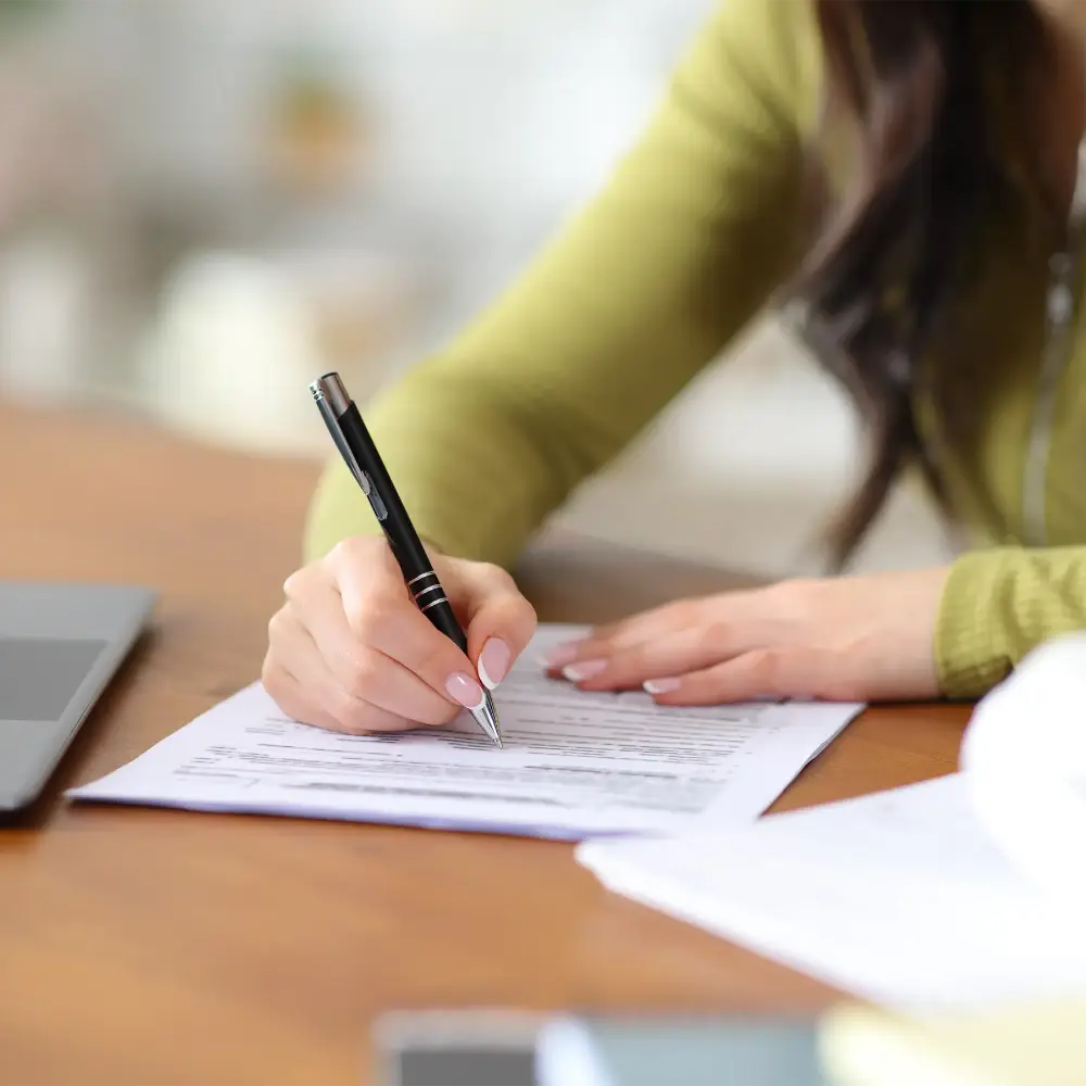 A district partner signing an agreement